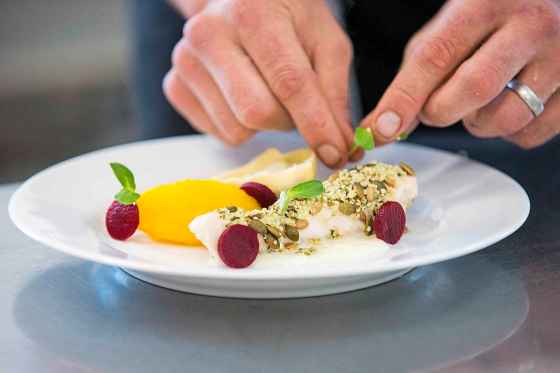 Chef Matty Neufeld’s fall dish of sunflower-oil-poached chicken breast with confit chicken leg and chanterelle tortellini, golden prairie cheese fondue, butternut squash, beets, toasted hemp seeds and sunflower shoots. (Mikaela MacKenzie / Winnipeg Free Press)