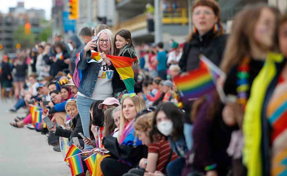 JOHN WOODS / WINNIPEG FREE PRESS
JOHN WOODS / WINNIPEG FREE PRESS
Melissa Peterson and daughter Ellie take part in the Pride Parade in downtown Winnipeg Sunday.