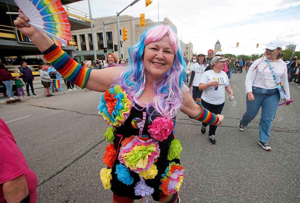 JOHN WOODS / WINNIPEG FREE PRESS
JOHN WOODS / WINNIPEG FREE PRESS
Pride parade participants march towards Portage Avenue on Sunday.