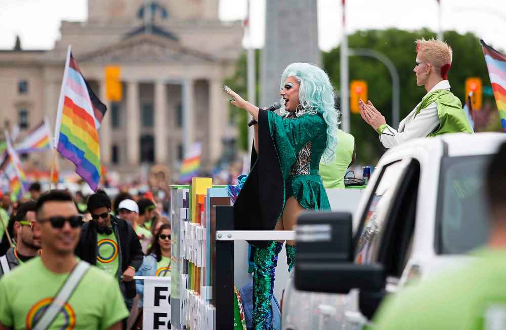 JOHN WOODS / WINNIPEG FREE PRESS
JOHN WOODS / WINNIPEG FREE PRESS
People take part in the Pride Parade in downtown near the Manitoba legislature.
