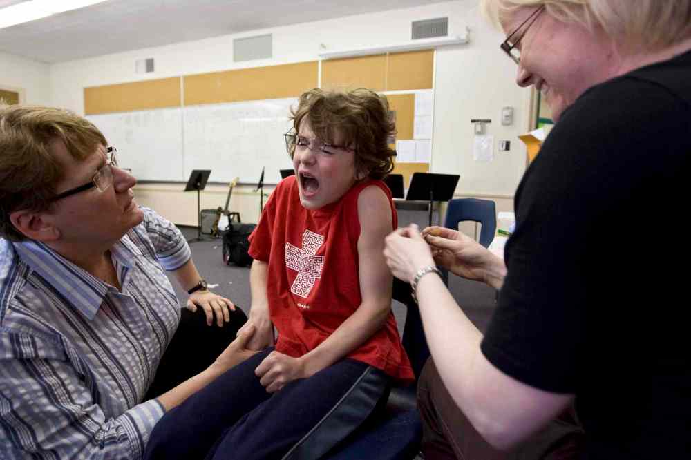 Grade 4: Noah shrieks moments after being pricked by a nurse's needle during the students' final set of childhood immunizations. (Ruth Bonneville / Winnipeg Free Press)