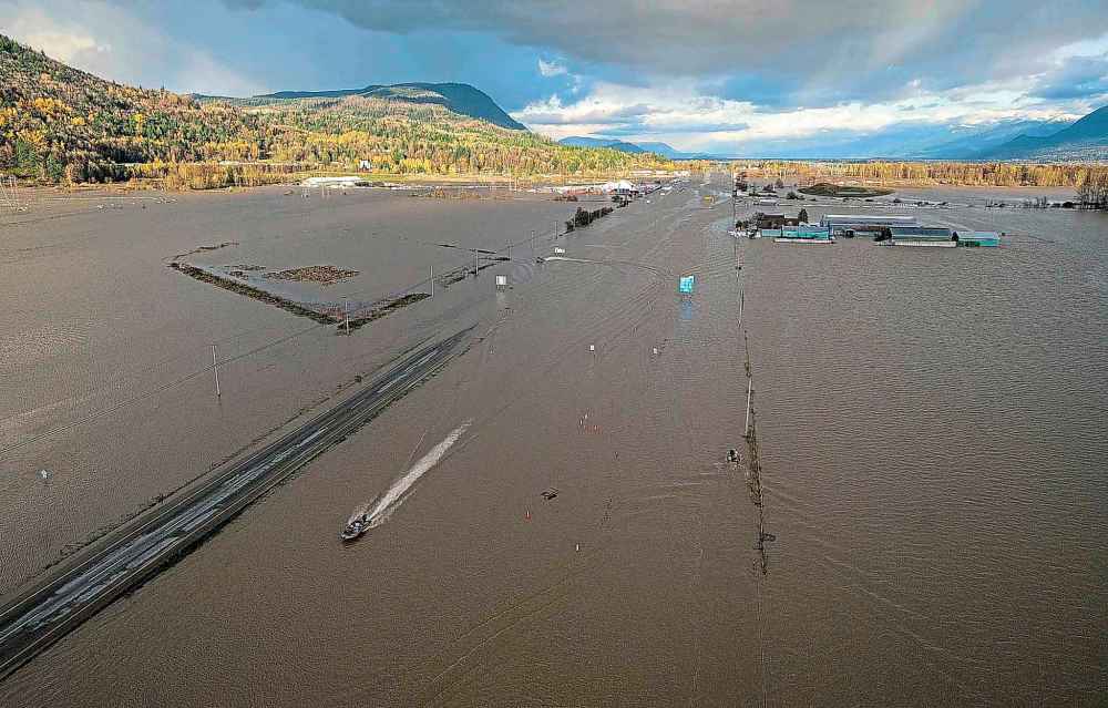 CP
A boat speeds along a flooded highway 1 in Abbotsford, B.C., Tuesday, Nov. 16, 2021. THE CANADIAN PRESS/Jonathan Hayward