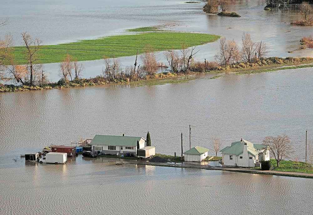CP
Rising flood waters surround a home in Chilliwack, B.C., Tuesday, Nov. 16, 2021. THE CANADIAN PRESS/Jonathan Hayward