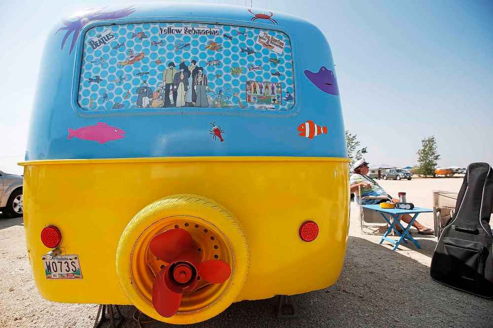 Angela Durand relaxes outside her Yellow Submarine themed trailer.
