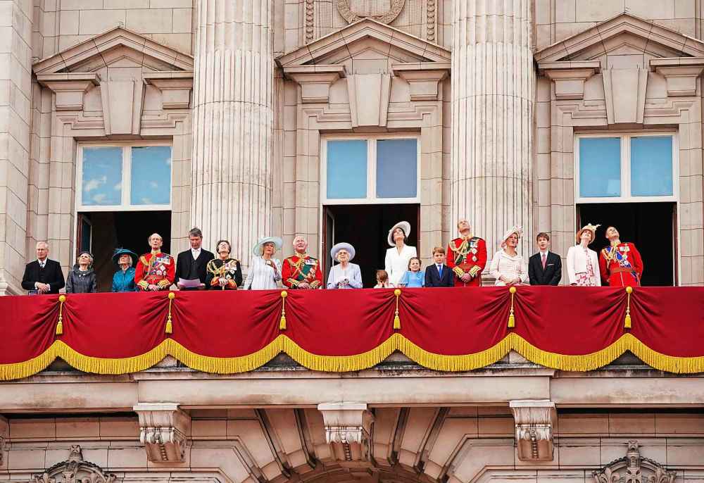 From left: The Duke of Gloucester, Duchess of Gloucester, Princess Alexandra, Duke of Kent, Tim Lawrence, Princess Anne, Camilla, Duchess of Cornwall, Prince Charles, Queen Elizabeth II, Prince Louis, Kate, Duchess of Cambridge, Princess Charlotte, Prince George, Prince William, Sophie, Countess of Wessex, Viscount Severn, Lady Louise Windsor and Prince Edward gather on the balcony of Buckingham Palace, London, as they watch a flypast of Royal Air Force aircraft pass over. (Jonathan Brady/Pool Photo via AP)