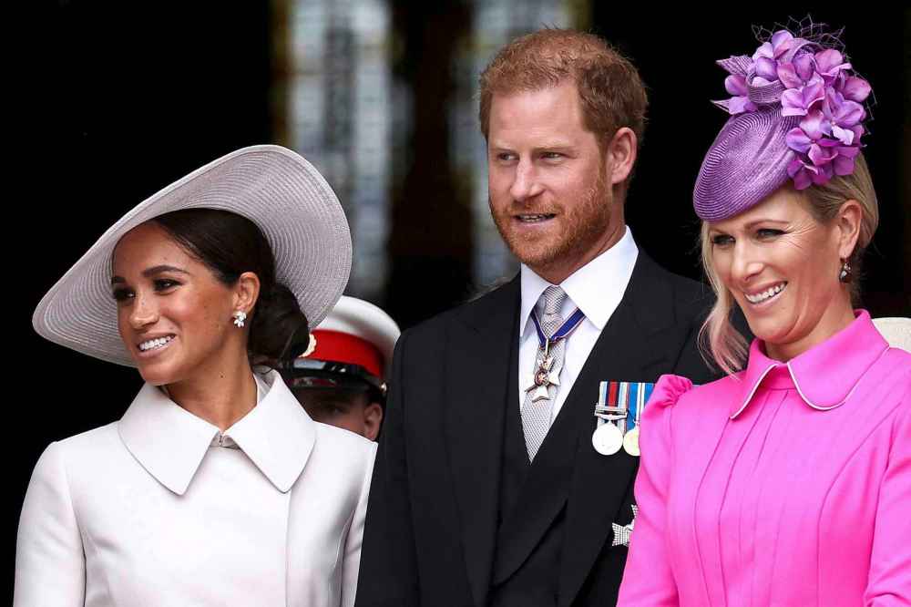 Prince Harry, center, Meghan, Duchess of Sussex, left, and Zara Tindall depart after attending a service of thanksgiving for the reign of Queen Elizabeth II at St Paul's Cathedral in London Friday June 3, 2022 on the second of four days of celebrations to mark the Platinum Jubilee. (Henry Nicholls, Pool Photo via AP)