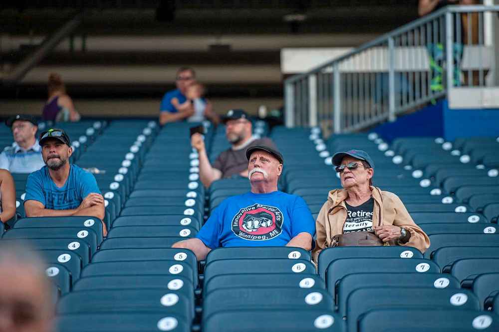 ETHAN CAIRNS / WINNIPEG FREE PRESS
Family and friends of runners sit in the stands of IG Stadium to cheer on runners as they come across the finish line.
