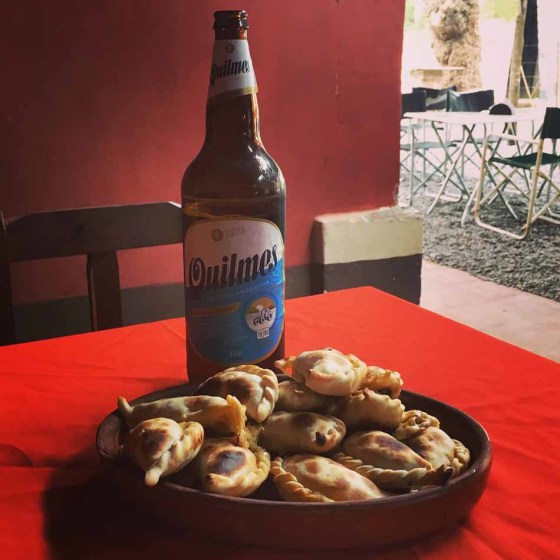 Empanadas and beer in the middle of nowhere in Argentina, 2017. A goat was tied up to a fence nearby. Whether it was a pet or a potential empanada filling, I cannot say. (Ben Sigurdson / Winnipeg Free Press)