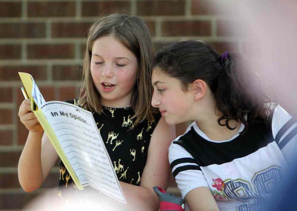 Dylan and Olive in grade 5/6 take part in writing skills class.