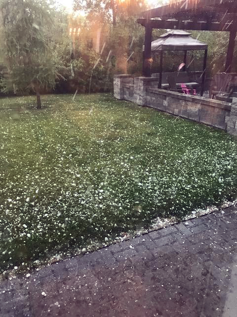 Jocelyn and Kevin Mitchell's backyard started to turn white from the hail just after 8 p.m. (Jocelyn Mitchell photo / Winnipeg Free Press)