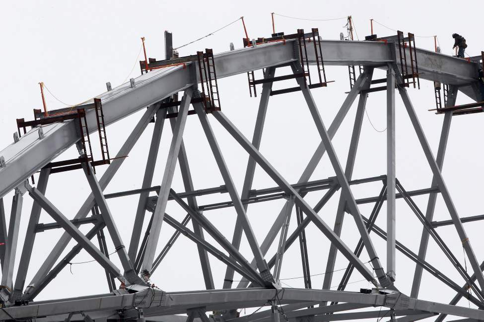 Workers align huge steel girders on the highest canopy on the East side of the new Investors Group Field stadium under construction at the University of Manitoba. The new $190 million stadium which will be home for the Winnipeg Blue Bombers will hold 33,422 people.
Monday, March 05, 2012
(JOE BRYKSA / WINNIPEG FREE PRESS)