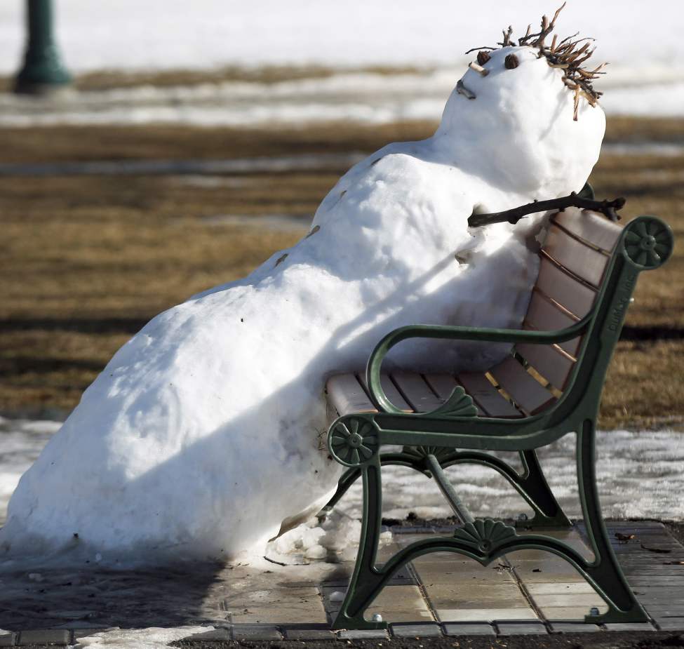 Help Me I'm Melllllting - A snowman melts on a bench on the grounds of the Manitoba Legislature in Winnipeg.
Sunday, March 11, 2012
(JOE BRYKSA / WINNIPEG FREE PRESS)