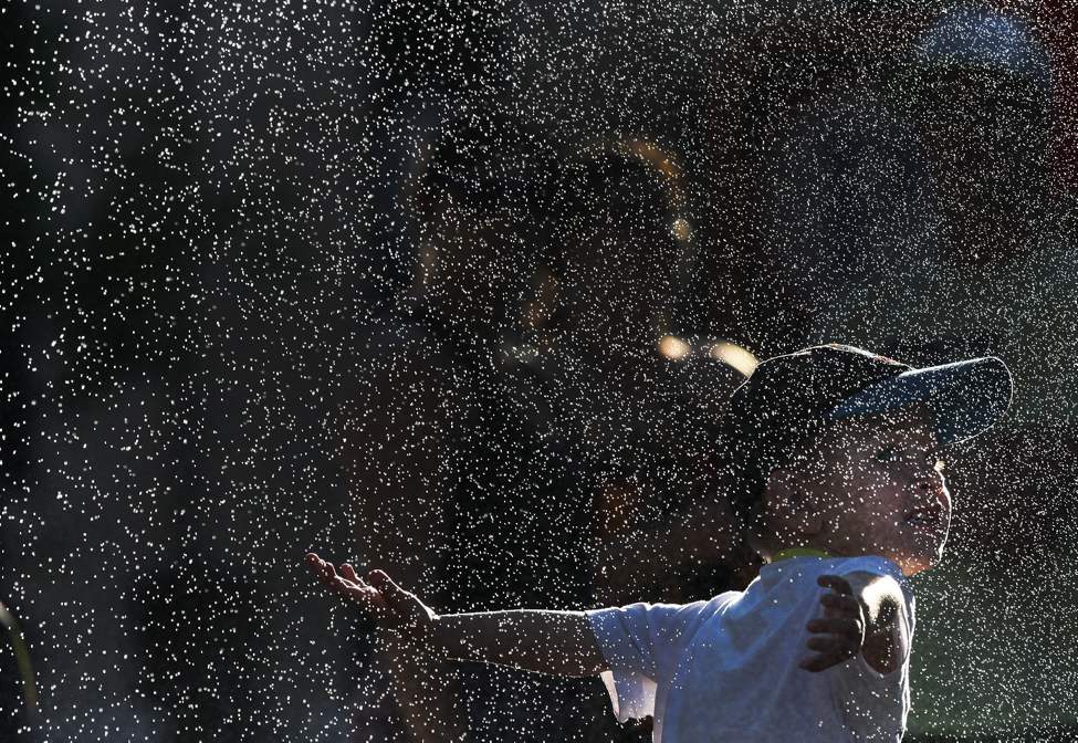 Kaleb Sarrasin , 3, cools off in a mist fountain at the Fringe Festival MTS Outdoor Stage in Old Market Square.
Friday, July 20, 2012
(JOE BRYKSA / WINNIPEG FREE PRESS)