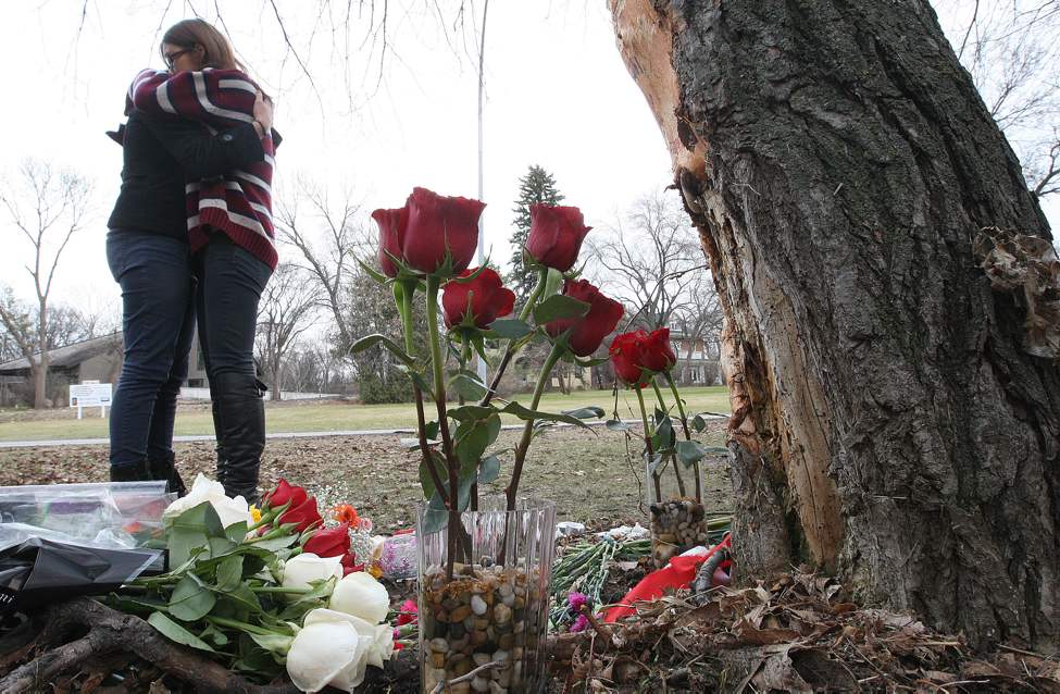 17-year-old Kelvin High School student Julia Romanow was killed in a car crash Thursday afternoon on Wellington Crescent. Kelvin High students hug after visiting crash scene.
Tuesday, November 02, 2012
(JOE BRYKSA / WINNIPEG FREE PRESS)