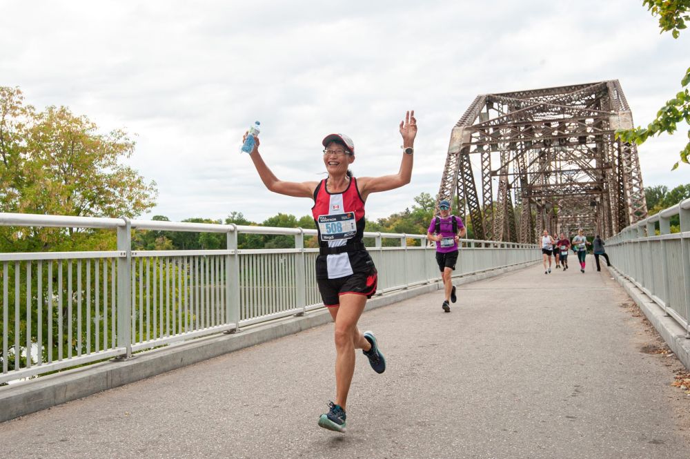 MIKE SUDOMA / Winnipeg Free Press
Marathon runner Mingdi Zhao cheers as she participates in the Manitoba Marathon on Sunday morning.