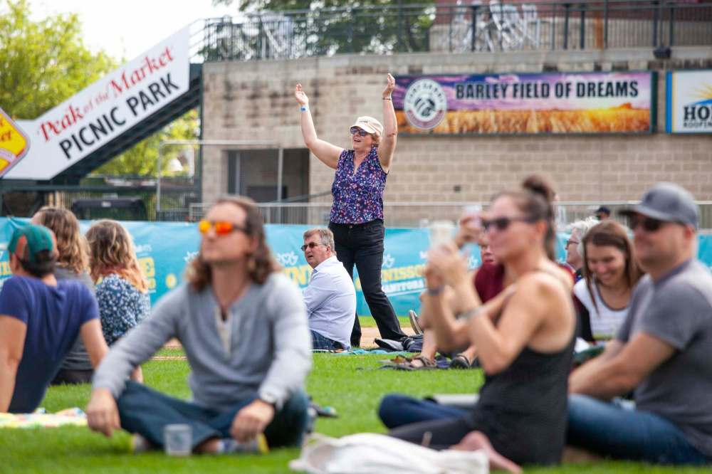 Cindy McKay dances to the live music during the concert. (Daniel Crump / Winnipeg Free Press)