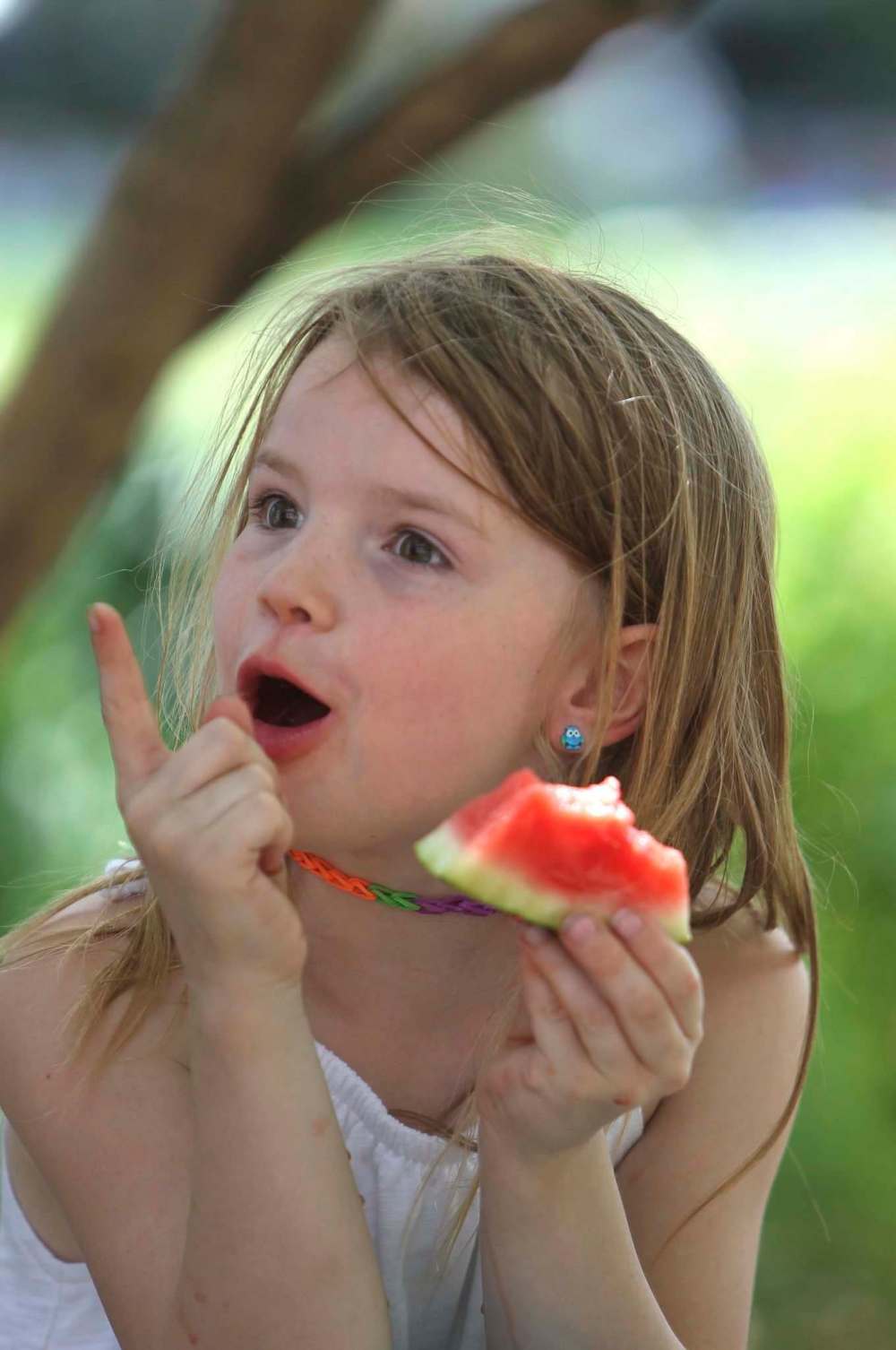 Grade 1 student Taya enjoys watermelon for lunch.