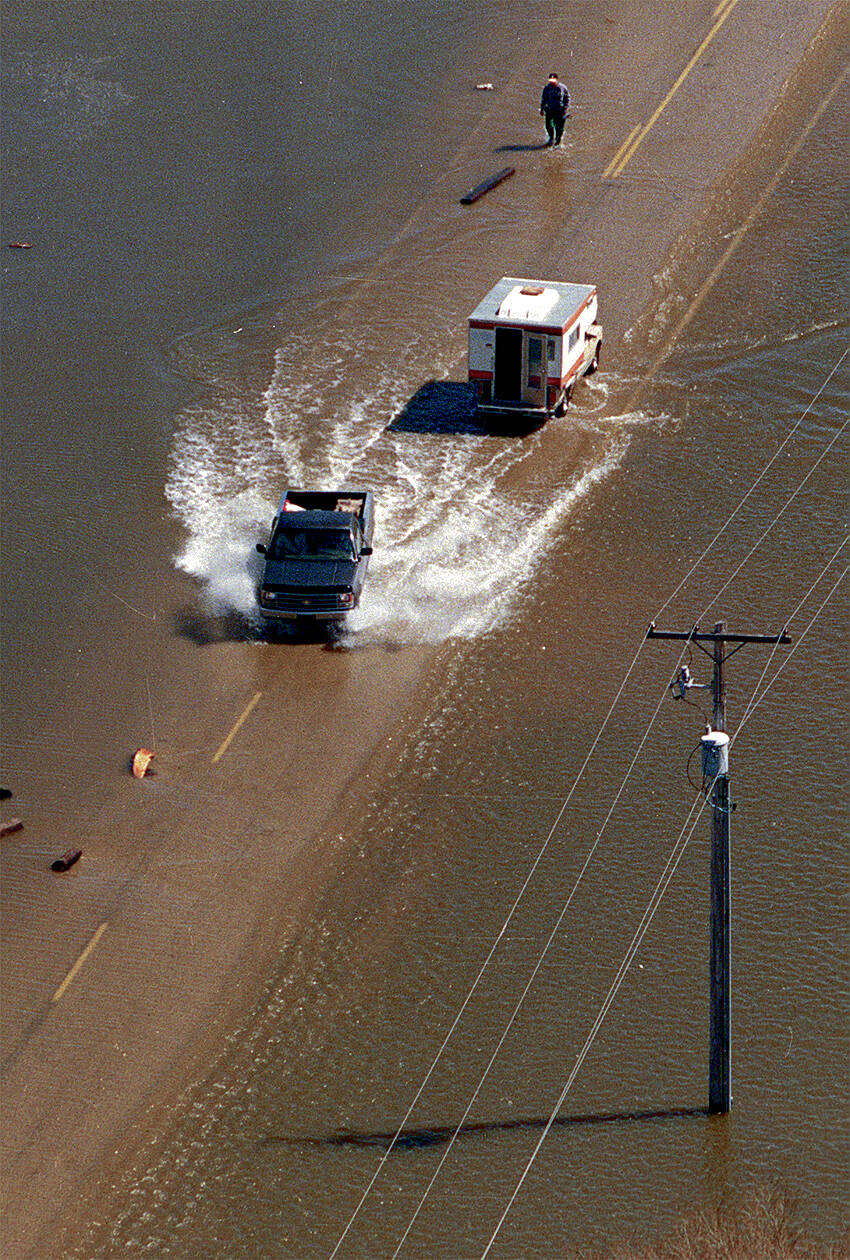 It was a wet trek finding a way into Grande Pointe. (Marc Gallant / Winnipeg Free Press files)