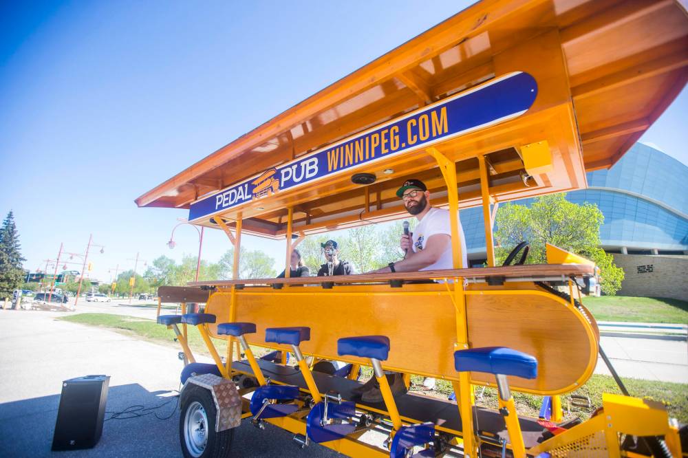 Pedal Pub takes customers to breweries, restaurants, and pubs under their own pedal power. The first of its kind in the city, the company has three bikes that seat 15 guests each. (Mikaela MacKenzie / Winnipeg Free Press)