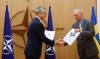 Johanna Geron/Pool via AP
NATO Secretary-General Jens Stoltenberg and Sweden’s Ambassador to NATO Axel Wernhoff shake hands during a May 18 ceremony in Brusssels to mark Sweden’s and Finland’s application for NATO membership.