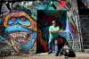 Dan Gordon cleans up the streets in and around Osborne Village where he picks up garbage and sweeps up debris, all on his own accord. (Ruth Bonneville / Winnipeg Free Press)