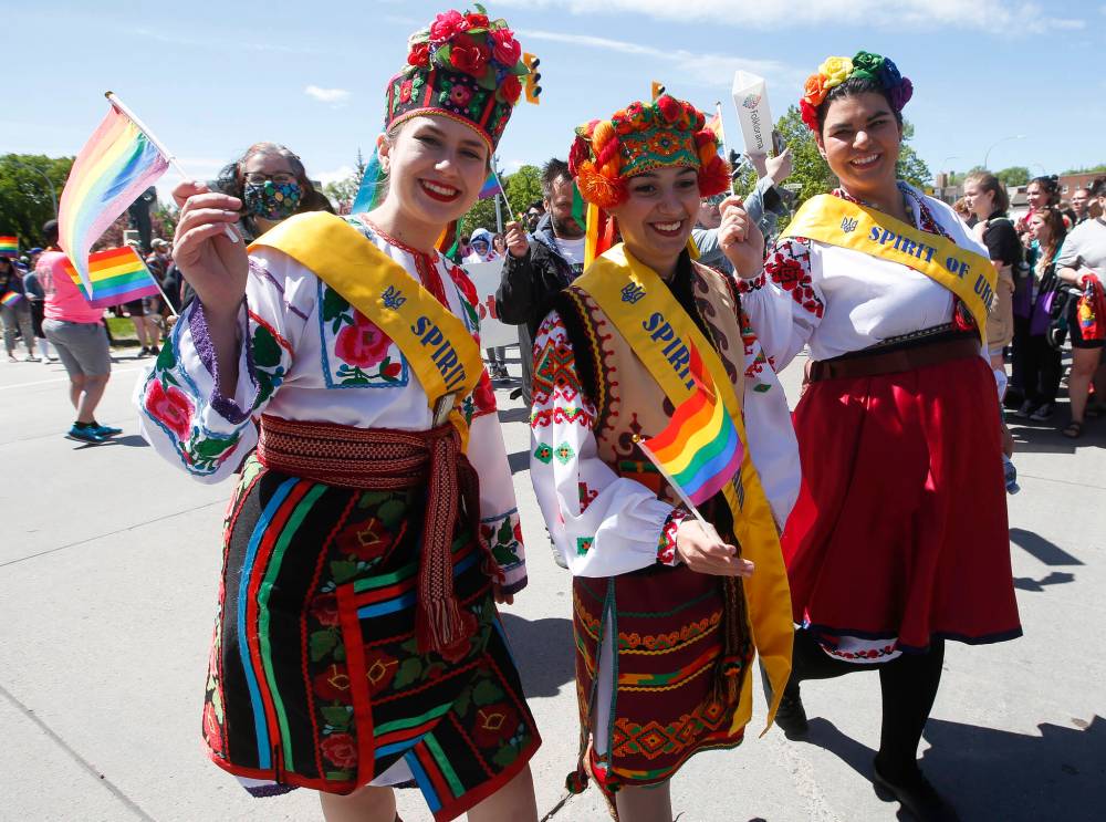 Thousands of Manitobans, touting rainbow flags and signs and pets and smiles, took to the street for the first annual Pride Winnipeg parade since the pandemic began. It was also the parade's 35th anniversary in the city. (John Woods / Winnipeg Free Press)