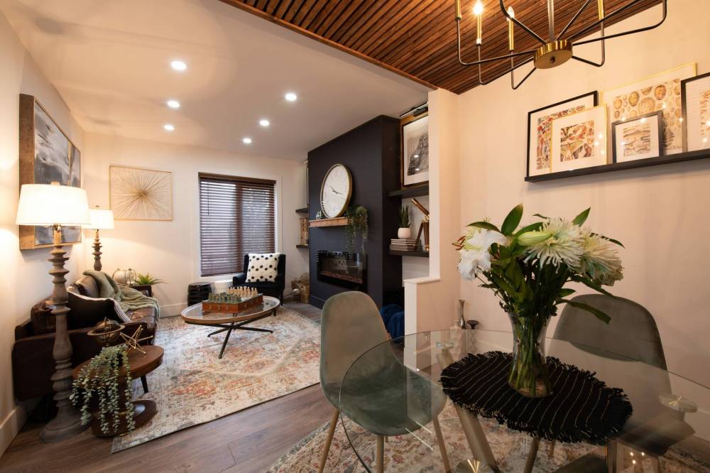 Supplied
By using wood paneling on the ceiling, the siblings successfully define a clear dining area within the living room space.