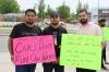 BRYCE HUNT / WINNIPEG FREE PRESS
Left to right: Manpreet Gill, Arjun Khera, Kuldeep Dhillon holding signs on a Regent Avenue sidewalk to strike against food delivery services.