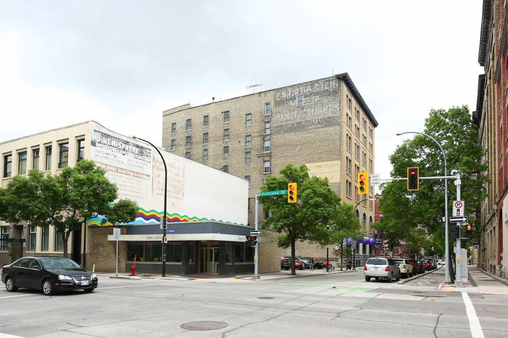 MIKE DEAL / WINNIPEG FREE PRESS
At 281 McDermot Ave., three ghost signs refuse to go to the grave.