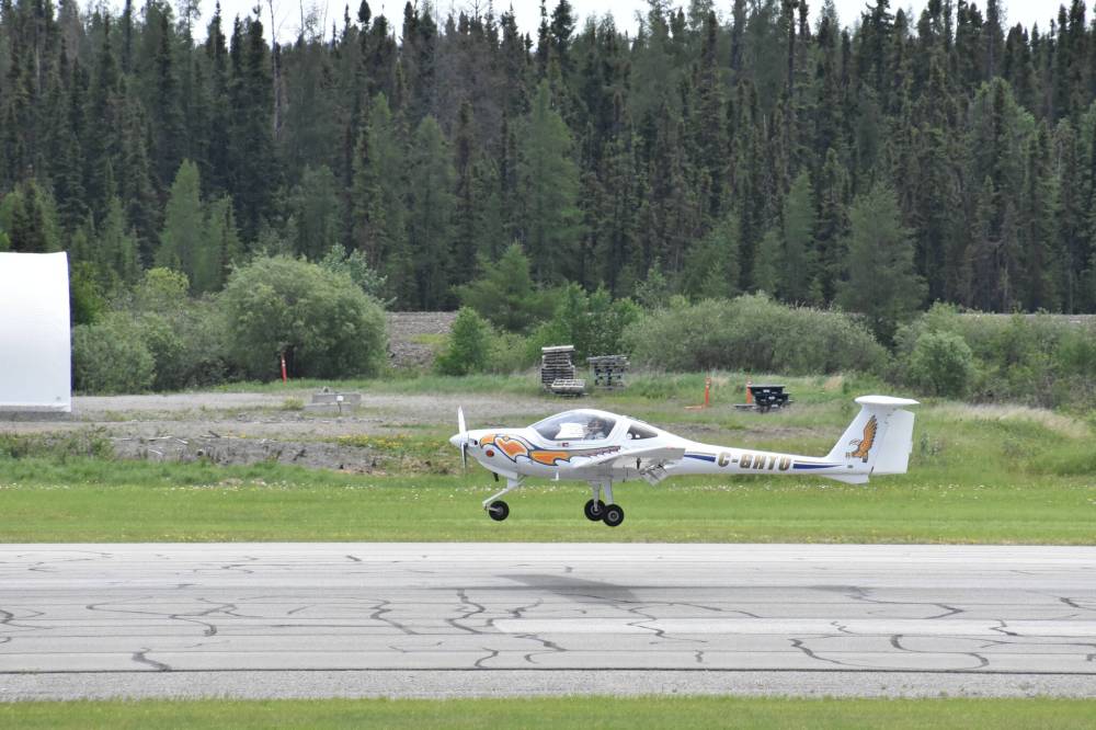 Tik Mason shows off the Diamond-Eclipse training plane with close to 100 people in attendance at the launch of the Indigenous pilot training program all out on the tarmac at the Thompson airport on Friday. (Supplied)