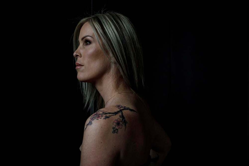 Andrea Joseph shows off one her tattoos in memory of her son Jaxon. (Jason Franson / The Canadian Press)