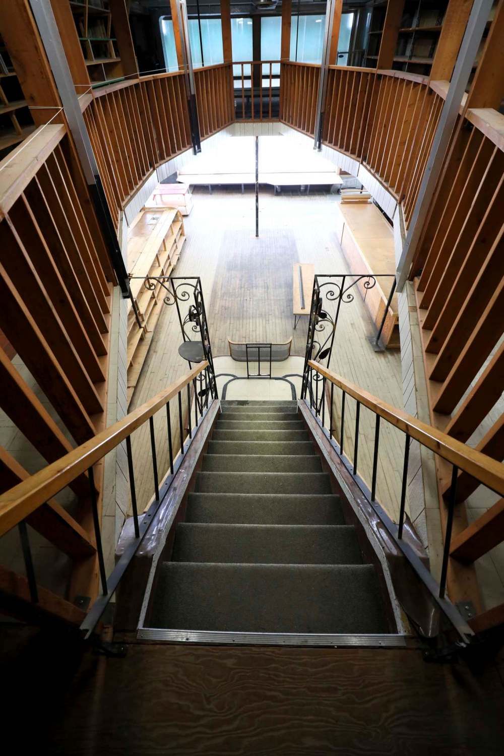 The view looking down from the mezzanine level through the railing.