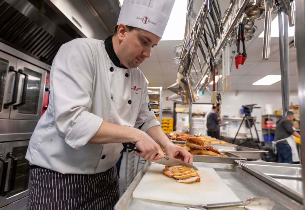 Siloam’s food services manager Chris Buffington prepares and the annual Easter meal.