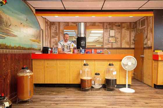 Bernhard Wieland behind the counter of his brewing space in the basement of the German Society of Winnipeg. (Mike Sudoma / Winnipeg Free Press files)
