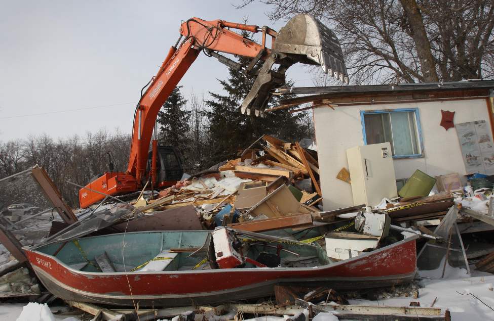 JOE BRYKSA/WINNIPEG FREE PRESS
Demolition crews started the process of knocking down cottages and homes in Breezy Point near the Red River North of Selkirk. A large ice jam caused by flooding last spring caused heavy damage in the area. The Province of Manitoba bought out many home and cottage owners last year. Most cottages and homes in the area will be destroyed and a few are planned to be moved.
February 2, 2010