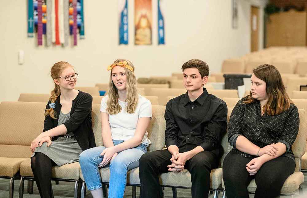 Mike Sudoma / Winnipeg Free Press
Helena Czaykowski (far left), Alex Gordon (right) and Maguire Steingart (far right) listen as Grace Pilkey (left) explains why she chose to sing Mamma Mia during her performance at the Winnipeg Music Festival at Churchill Park Church, Thursday.