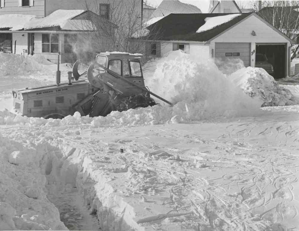 A plow clears out Hind Avenue in St. James. (Jack Ablett / Winnipeg Free Press Archives)