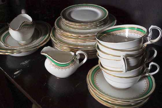 The delicate porcelain plates currently live in a dining room cabinet full of booze bottles and board games. (Eva Wasney / Winnipeg Free Press)