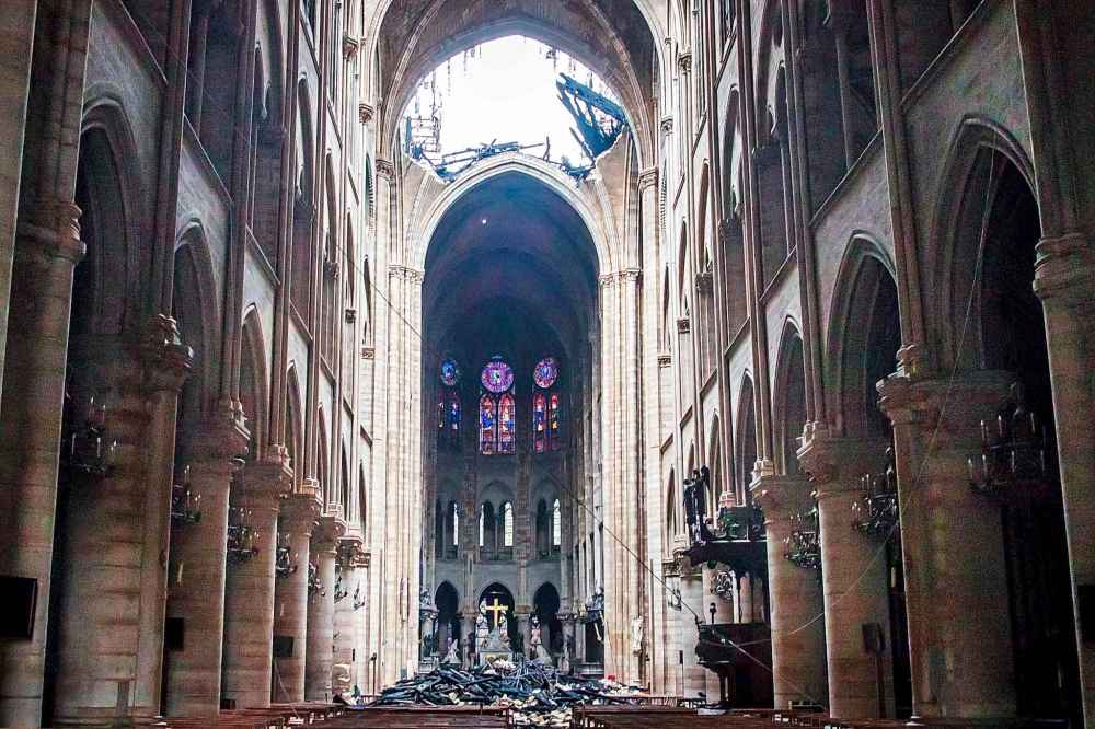 A hole is seen in the dome inside Notre Dame cathedral in Paris, Tuesday. (Christophe Petit Tesson / The Associated Press)