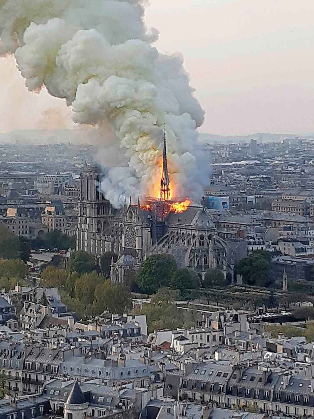 Flames and smoke rise from the blaze at Notre Dame cathedral in Paris, Monday. (Cedric Herpson / The Associated Press)