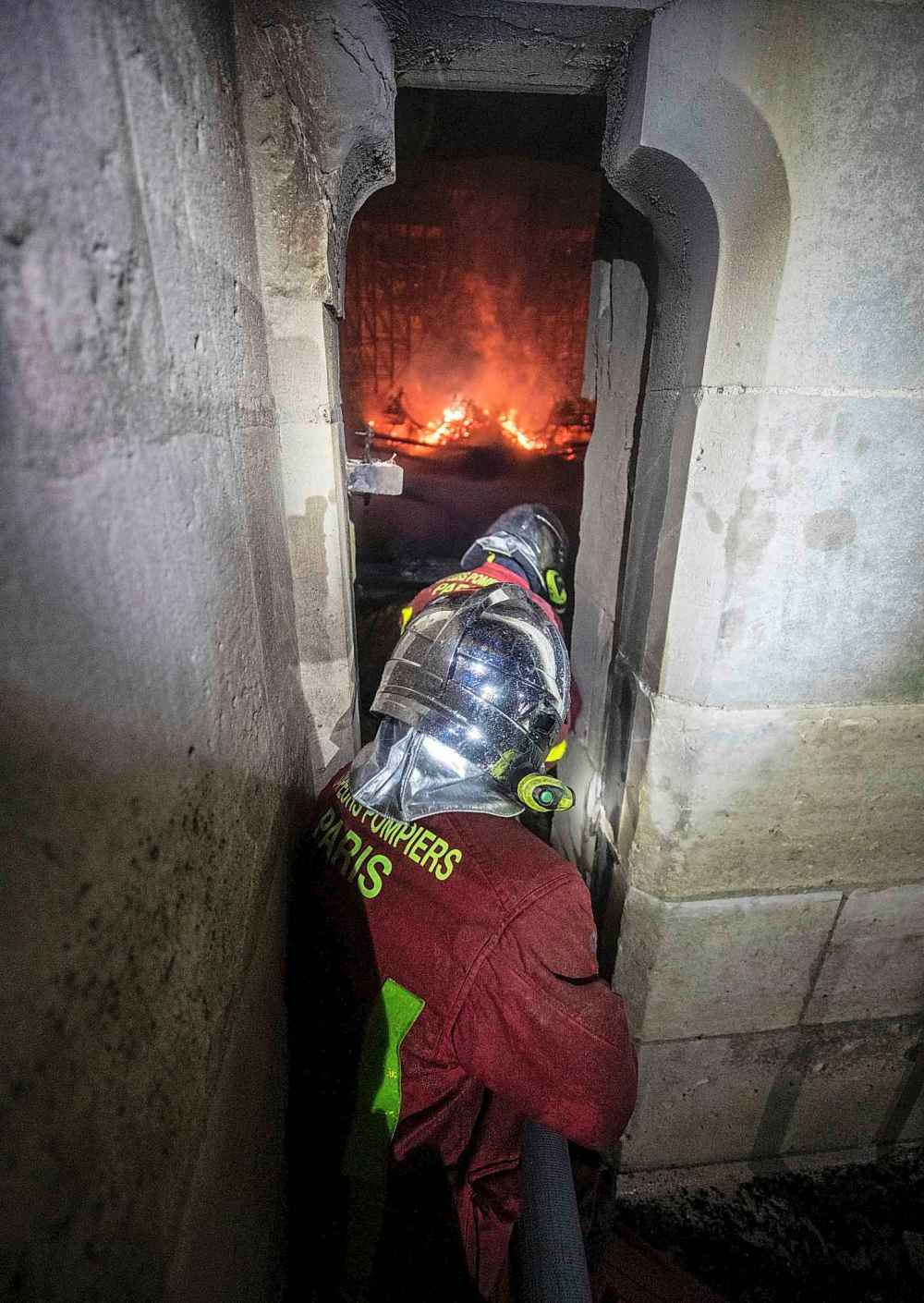 This photo provided by the Paris Fire Brigade shows fire fighters battling the fire inside Notre Dame cathedral. (Benoit Moser, BSPP via The Associated Press)