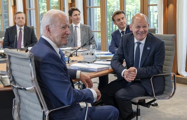 Prime Minister Justin Trudeau joins Italian Prime Minister Mario Draghi, US President Joe Biden, French President Emanuel Macron, and German Chancellor Olaf Scholz around the table for the first plenary session at the G7 Summit in Elmau, Germany on Sunday, June 26, 2022. THE CANADIAN PRESS/Paul Chiasson