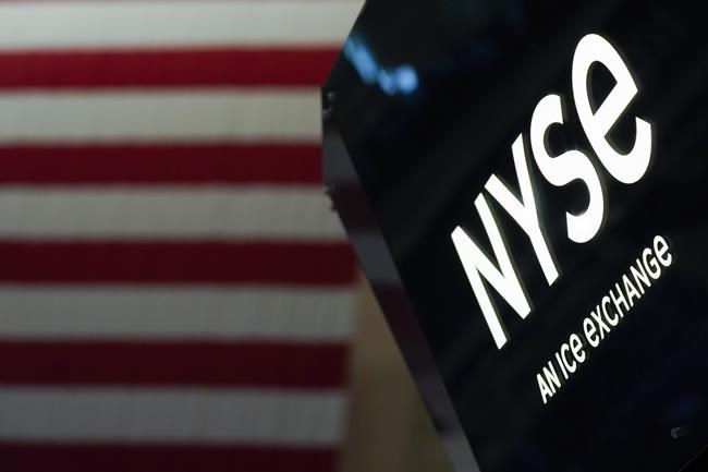 FILE - An NYSE sign is seen on the floor at the New York Stock Exchange in New York, June 15, 2022. Stocks are drifting mostly lower in early trading on Wall Street Monday, June 27, 2022 as the market cools off following a rare winning week and the best daily gain for the S&P 500 in two years. (AP Photo/Seth Wenig, file)