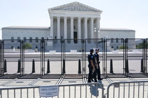 Security works outside of the Supreme Court, Thursday, June 30, 2022, in Washington. (AP Photo/Jacquelyn Martin)