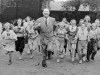 FILE - Big Jim Thorpe, famed American athlete and former U.S. Olympic great, center, sets a fast pace for some girls during a 