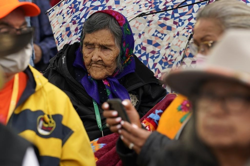 Indigenous people wait for Pope Francis during his visit to Maskwaci, the former Ermineskin Residential School, Monday, July 25, 2022, in Maskwacis, Alberta. Pope Francis traveled to Canada to apologize to Indigenous peoples for the abuses committed by Catholic missionaries in the country's notorious residential schools. (AP Photo/Eric Gay)