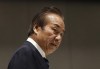 FILE - Haruyuki Takahashi, then executive board member of the Tokyo Organizing Committee of the Olympic and Paralympic Games arrives at Tokyo 2020 Executive Board Meeting in Tokyo, Japan on March 30, 2020. Prosecutors searched the home of former Tokyo Olympic organizing committee executive board member Takahashi on Tuesday, July 26, 2022, in connection with payments made to him by an Olympic sponsor of the Tokyo Games, the Japanese news agency Kyodo reported. (Issei Kato/Pool Photo via AP, File)
