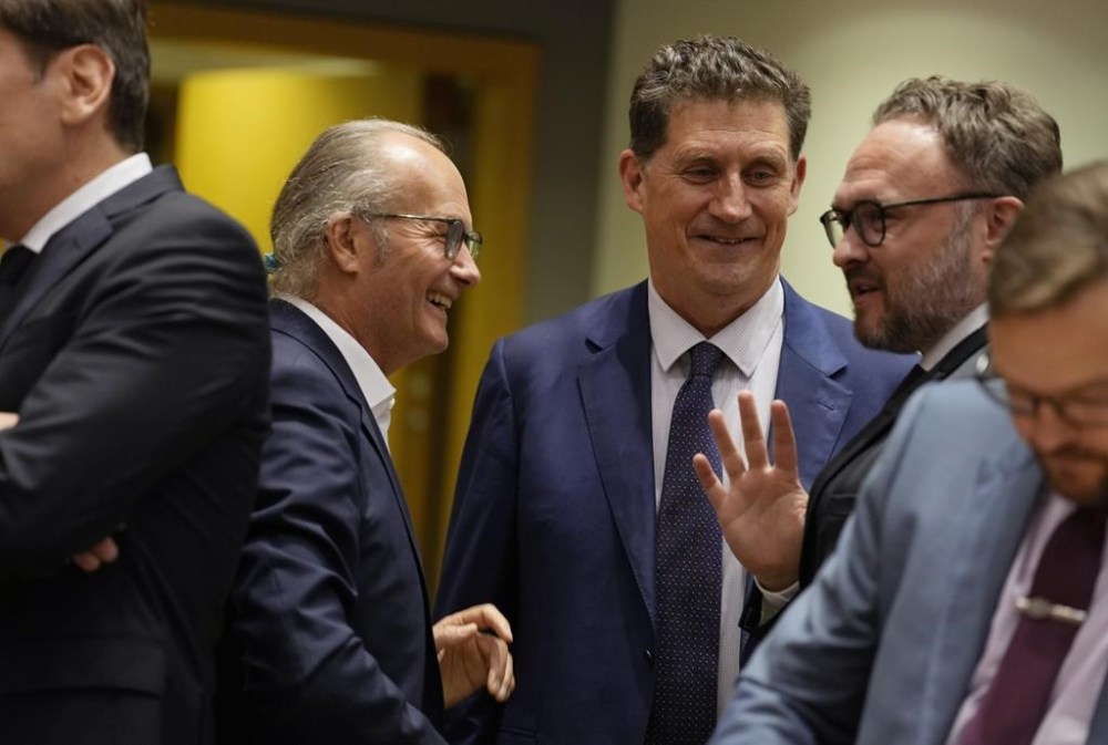 Luxembourg's Energy Minister Claude Turmes, second left, speaks with Denmark's Minister for Climate Dan Jorgensen, second right, and Ireland's Minister for the Environment Eamon Ryan during an emergency meeting of EU energy ministers in Brussels on Tuesday, July 26, 2022. European Union governments Tuesday neared an agreement on rationing natural gas this winter to protect against any further supply cuts by Russia. (AP Photo/Virginia Mayo)