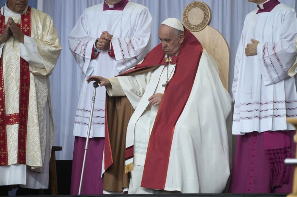 Pope Francis presides over a mass at the the Commonwealth Stadium in Edmonton, Canada, Tuesday, July 26, 2022. Pope Francis is on a second day of a