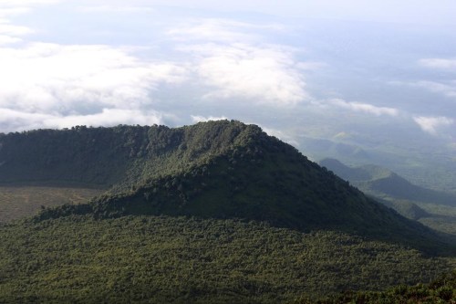 FILE - This Dec. 11, 2016, photo shows the Virunga National Park, taken from the rim of the crater of the Nyiragongo volcano and looking over the crater of another, extinct volcano, in North Kivu Province, Democratic Republic of the Congo. Several oil and gas fields in the DRC, including some in the park, are being put up for auction starting Thursday, July 28, 2022, prompting outrage from environmental groups. (Juergen Baetz/dpa via AP, File)